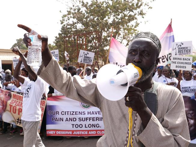 A demonstrator is seen in Banjul, Gambia, on January 25, 2020. Two radio stations were recently shut down and their staffers arrested over their coverage of the protests. (AFP/Romain Chanson)