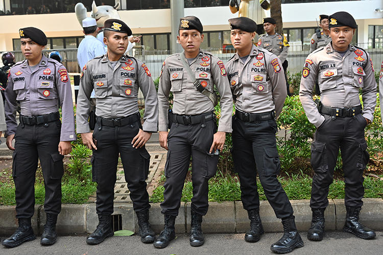 Police officers are seen in Jakarta, Indonesia, on April 7, 2019. Authorities recently arrested and detained U.S. environmental journalist Philip Jacobson. (AFP/Adek Berry)