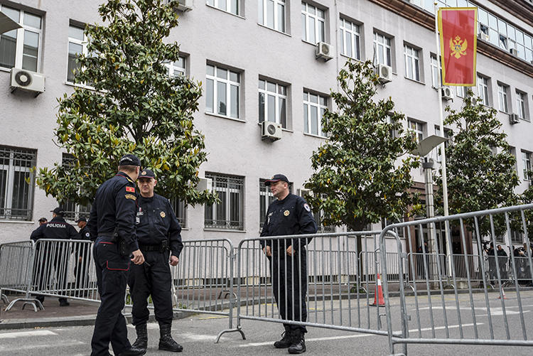 Montenegro police officers are seen Podgorica, the capital, on May 9, 2019. Police recently arrested two journalists for alleged criminal incitement. (AFP/Savo Prelevic)