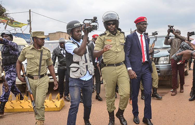 Ugandan politician Robert Kyagulanyi, also known as Bobi Wine, is seen in Kasangati on January 6, 2020. Four journalists were arrested during Wine's visit to Kasangati, and others were questioned by police at another event. (AFP)