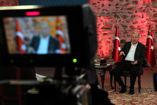 Turkish President Recep Tayyip Erdogan gives a televised interview in Istanbul on January 5, 2020. The Turkish government recently cancelled hundreds of journalists' press passes. (Presidential Press Service via AP)
