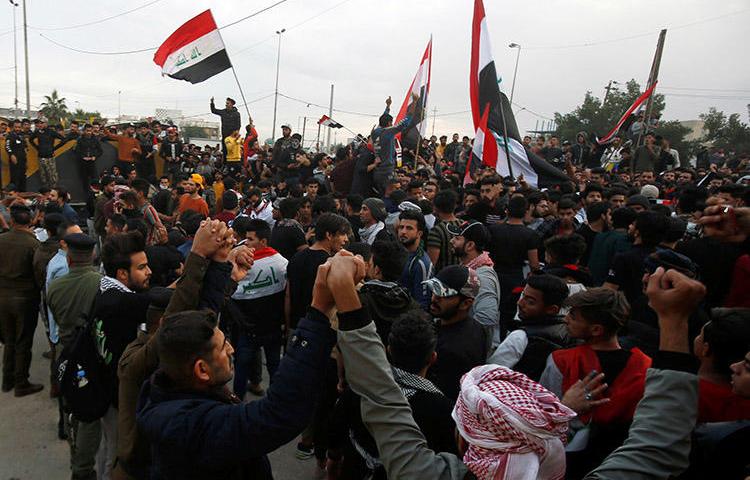 Iraqi demonstrators gather in Basra on January 10. Gunmen killed two journalists from the Iraqi broadcaster Dijlah TV, who were covering the protests. (Reuters/Essam al-Sudani)