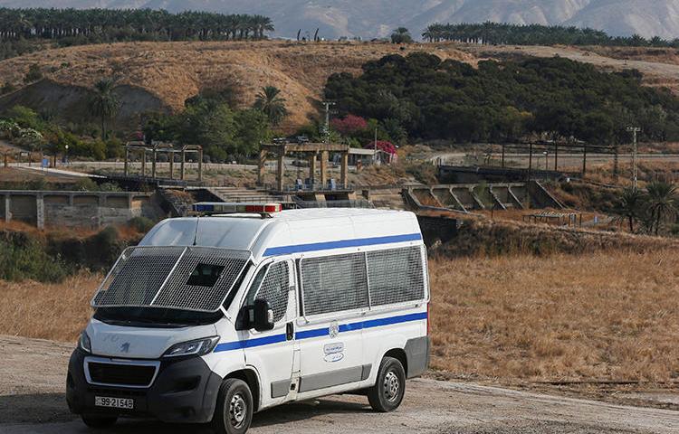 A Jordanian police vehicle is seen near the Israeli border on November 13, 2019. Jordanian authorities recently suspended broadcaster Dijlah TV, and the station's offices in Iraq were raided by local authorities. (Reuters/Muhammad Hamed)