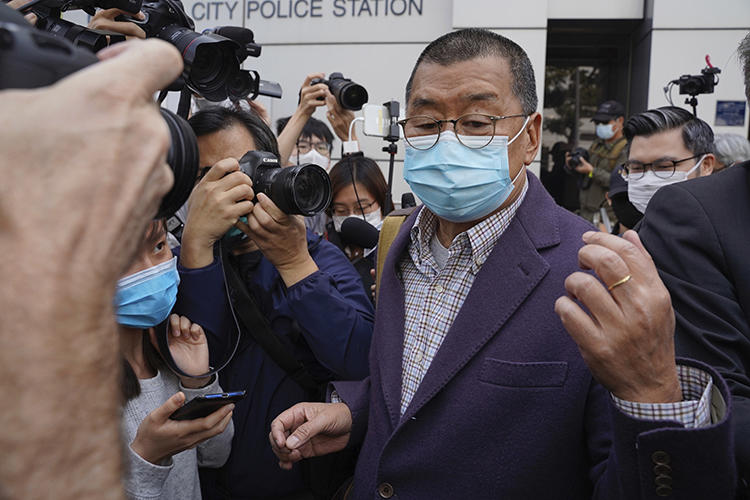 Jimmy Lai, founder of Hong Kong's Apple Daily newspaper, leaves a police station in Hong Kong on February 28, 2020 after being held over his participation in a pro-democracy protest. Lai's independent media house has been harassed for its pro-democracy stance. (The Initium Media via AP/Lam Chun Tung)