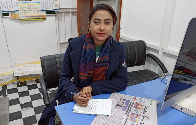 Journalist Babie Shirin is pictured in the office of the Imphal Free Press newspaper. The chief minister of Manipur accused the publication of criminal defamation in relation to an article Shirin wrote in 2018. (IFP/Telheiba)