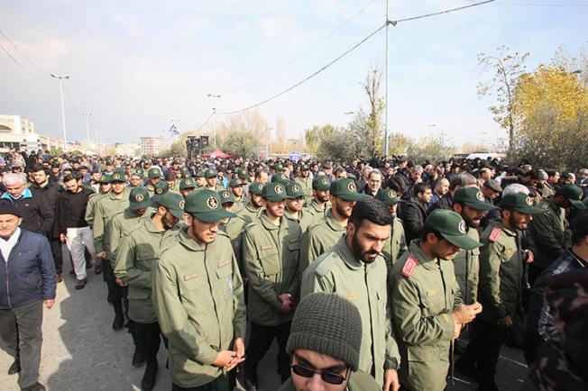 Members of Iran's Islamic Revolutionary Guard Corps are seen in Tehran on January 3, 2020. Intelligence agents recently raided the homes of four journalists. (AFP/Atta Kenare)