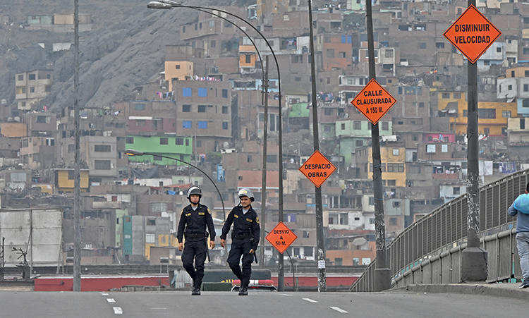Police are seen in Lima, Peru, on October 1, 2019. Journalist Daysi Lizeth Mina Huamán recently went missing in Peru. (AFP/Cris Bournoncle)