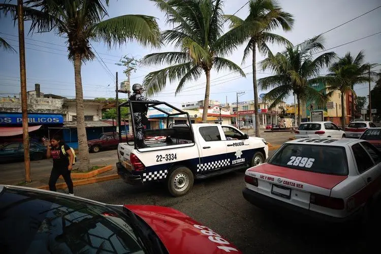 A state police truck patrols in Coatzacoalcos, Veracruz state, Mexico, on August 30, 2019. Mexican police attacked reporters during a protest in Ciudad Isla, Veracruz, on February 11, 2020. (AP Photo/Rebecca Blackwell)