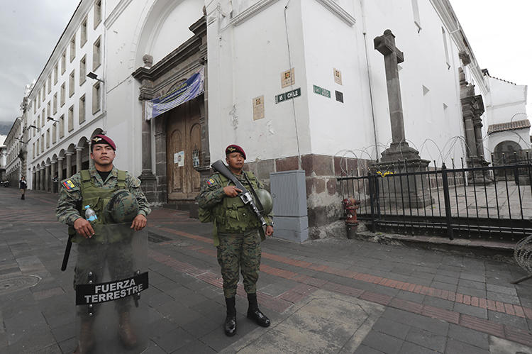Soldiers are seen in Quito, Ecuador, on October 17, 2019. Ecuadorian journalist Andrés Mendoza recently received a death threat. (AP/Dolores Ochoa)