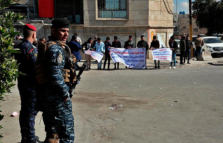 Security forces are seen in Baghdad, Iraq, on February 10, 2020. Al-Rasheed TV chief executive officer Nizar Thanoun was recently shot and killed in Baghdad. (AP/Hadi Mizban)