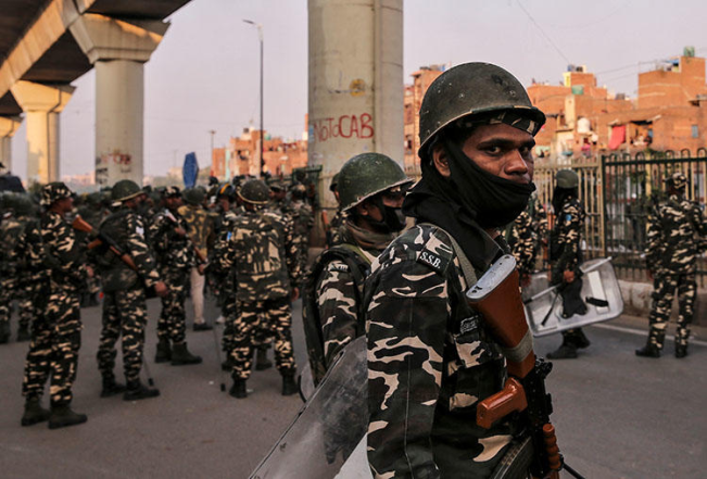 Paramilitary troops are seen in New Delhi, India, after clashes erupted between people demonstrating for and against a new citizenship law on February 25, 2020. (Reuters/Danish Siddiqui)