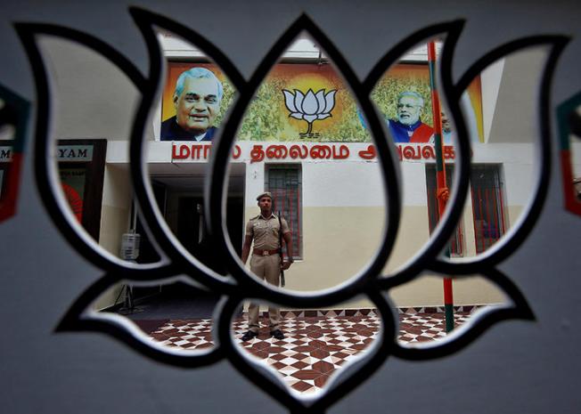 A police officer is seen at the office of India's ruling Bharatiya Janata Party in Chennai on November 9, 2019. BJP officials recently incited a harassment campaign against journalist Arfa Khanum Sherwani. (Reuters/P. Ravikumar)