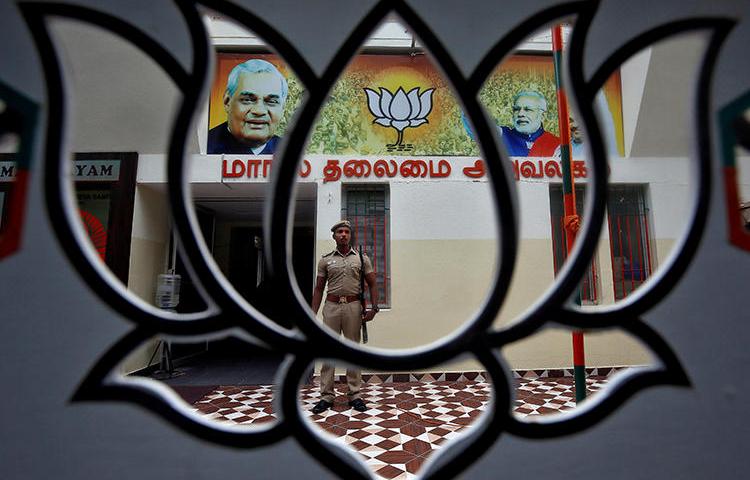 A police officer is seen at the office of India's ruling Bharatiya Janata Party in Chennai on November 9, 2019. BJP officials recently incited a harassment campaign against journalist Arfa Khanum Sherwani. (Reuters/P. Ravikumar)