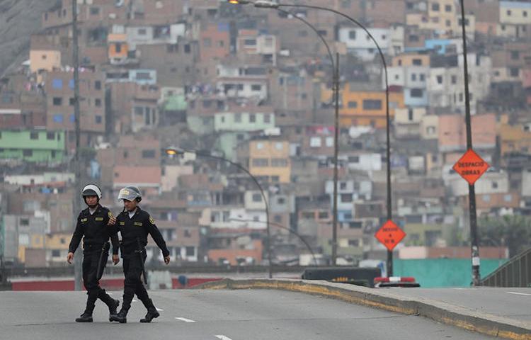 Police are seen in Lima, Peru, on October 1, 2019. Two journalists recently requested police protection after receiving threats and being surveilled. (Reuters/Guadalupe Pardo)