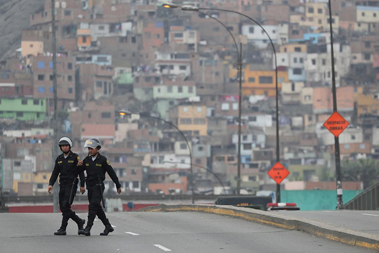 Police are seen in Lima, Peru, on October 1, 2019. Two journalists recently requested police protection after receiving threats and being surveilled. (Reuters/Guadalupe Pardo)