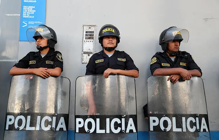 Police officers are seen in Lima, Peru, on March 19, 2019. Journalist Jimmy Alejandro Castillo Gamarra was recently assaulted in the town of San Marcos, in northern Peru. (Reuters/Guadalupe Pardo)