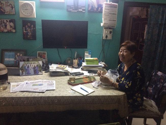 Journalist Valley Rose Hungyo sits at her dinner table in her home in Manipur, India. Hungyo recently talked to CPJ about running the only newspaper for Nagas in Manipur. (CPJ/Aliya Iftikhar)