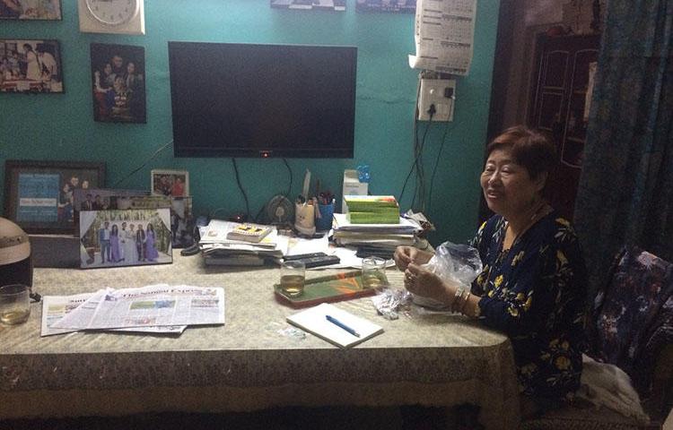 Journalist Valley Rose Hungyo sits at her dinner table in her home in Manipur, India. Hungyo recently talked to CPJ about running the only newspaper for Nagas in Manipur. (CPJ/Aliya Iftikhar)