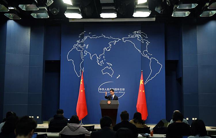 Chinese Foreign Ministry spokesperson Geng Shuang speaks during the daily press briefing in Beijing on March 18, 2020. China's Foreign Ministry recently announced it would take action to expel more than a dozen U.S. journalists. (AFP/Greg Baker)