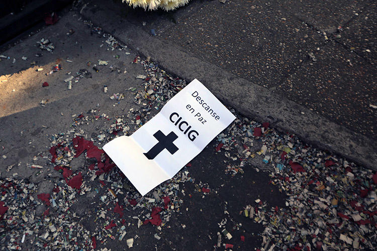 A sign reading ‘Rest in peace CICIG’ is seen during a protest against the U.N.-backed anti-corruption commission in Guatemala City in January 2019. Online harassment campaigns attempted to discredit journalists covering the commission. (AFP/Noe Perez)