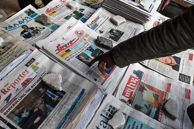 Newspapers are seen in Addis Ababa, Ethiopia, on June 24, 2019. Police recently arrested two journalists and their driver in Burayu, a town in the Oromia region. (AFP/Eduardo Soteras)