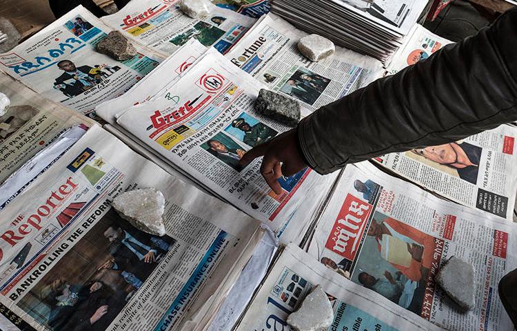 Newspapers are seen in Addis Ababa, Ethiopia, on June 24, 2019. Police recently arrested two journalists and their driver in Burayu, a town in the Oromia region. (AFP/Eduardo Soteras)