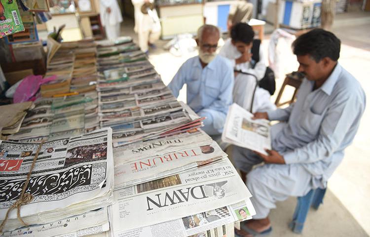 Newspapers are seen in Karachi, Pakistan, on May 20, 2018. The Pakistan government recently suspended advertising to two independent media groups. (AFP/Rizwan Tabassum)