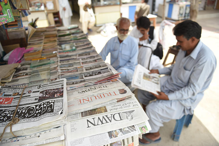 Newspapers are seen in Karachi, Pakistan, on May 20, 2018. The Pakistan government recently suspended advertising to two independent media groups. (AFP/Rizwan Tabassum)