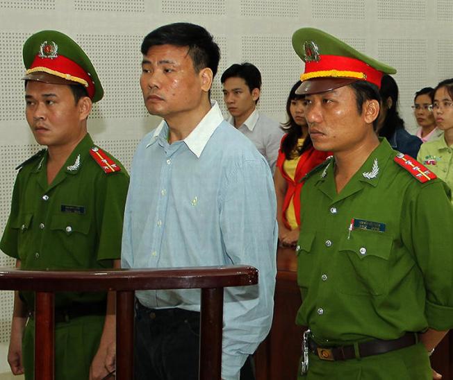 Blogger Truong Duy Nhat is seen at a local People's Court in Da Nang, Vietnam, on March 4, 2014. In a separate case today, Nhat was sentenced to 10 years in prison for his writing. (AFP/Vietnam News Agency)