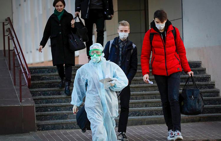 A medical worker is seen in Minsk, Belarus, on March 13, 2020. Journalist Siarhei Satsuk was recently detained on bribery charges after publishing reporting on COVID-19. (AP/Sergei Grits)