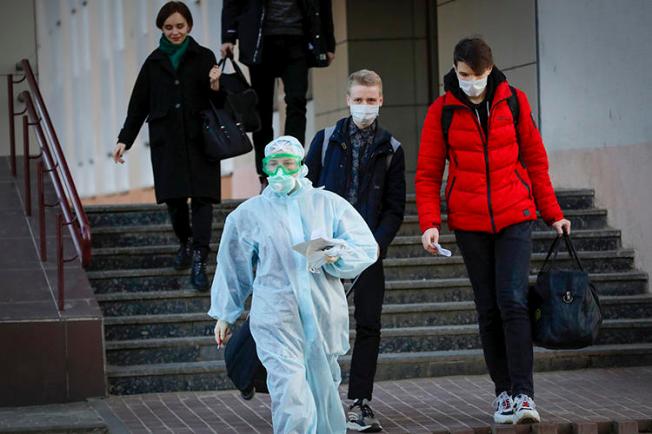 A medical worker is seen in Minsk, Belarus, on March 13, 2020. Journalist Siarhei Satsuk was recently detained on bribery charges after publishing reporting on COVID-19. (AP/Sergei Grits)