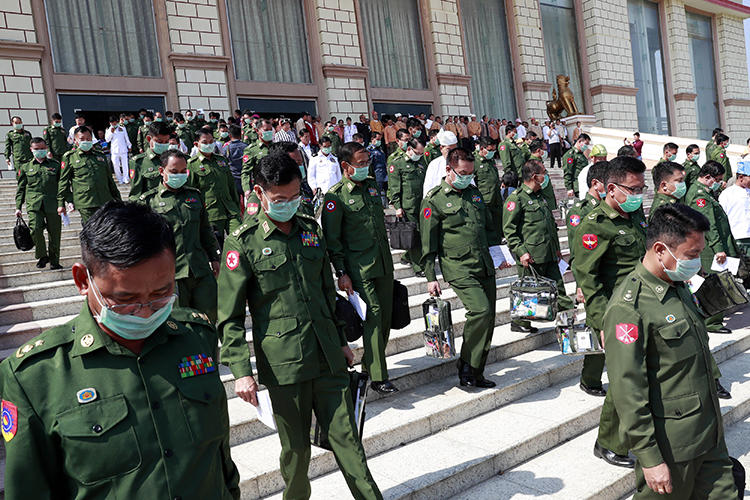 Military representatives are seen in Naypyitaw, Myanmar, on March 10, 2020. The Myanmar military is suing Ye Ni, Burmese-language editor of the independent news website The Irrawaddy, for criminal defamation. (AP/Aung Shine Oo)