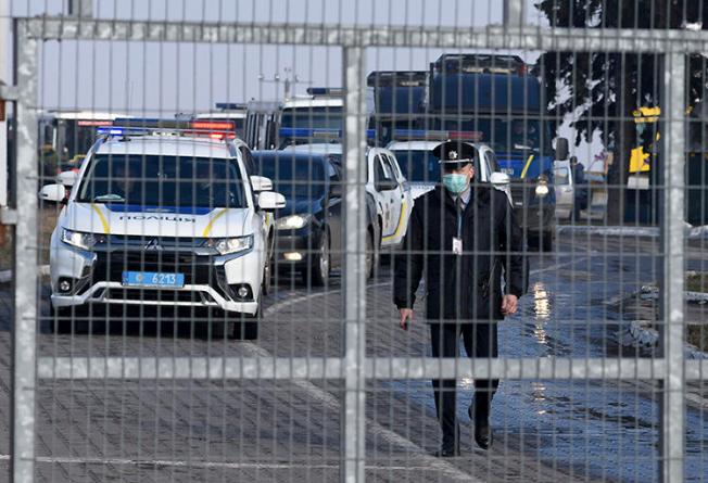 Police officers are seen in Kharkiv, Ukraine, on February 20, 2020. Local investigative outlet Slidstvo.Info is potentially facing a criminal investigation for its reporting. (AP/Igor Chekachkov)