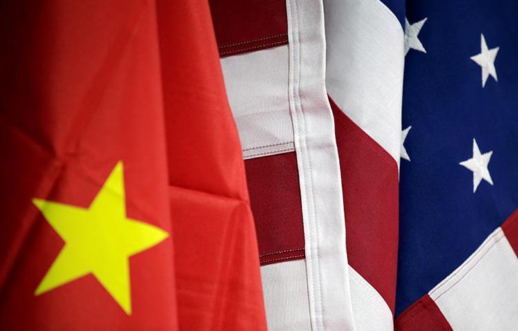 U.S. and Chinese flags are seen in Beijing, China, on May 28, 2019. The U.S. State Department recently announced a cap on visas for five Chinese state media outlets. (Reuters/Jason Lee)