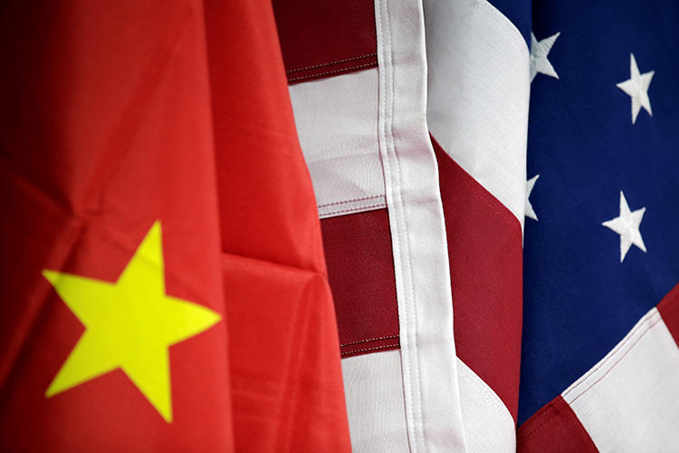 U.S. and Chinese flags are seen in Beijing, China, on May 28, 2019. The U.S. State Department recently announced a cap on visas for five Chinese state media outlets. (Reuters/Jason Lee)