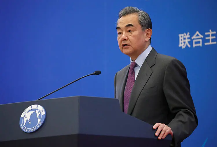 Chinese Foreign Minister Wang Yi is seen in Beijing on December 13, 2019. The Chinese Ministry of Foreign Affairs today announced that U.S. journalists at three major outlets would have their press credentials cancelled. (Reuters/Jason Lee)