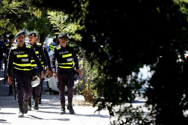 Police officers are seen in Amman, Jordan, on October 3, 2019. Jordanian journalist Hiba Abu Taha was recently charged with slander over a 2012 interview. (Reuters/Muhammad Hamed)