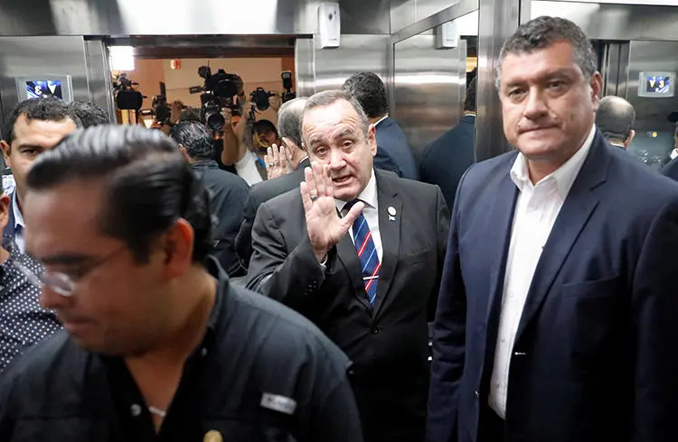 Guatemalan President-elect Alejandro Giammattei waves as he attends a news conference in Guatemala City on August 13, 2019. His administration is seen as more open than that of his predecessor but local journalists note a defensive attitude on some occasions. (Reuters/Jose Cabezas)