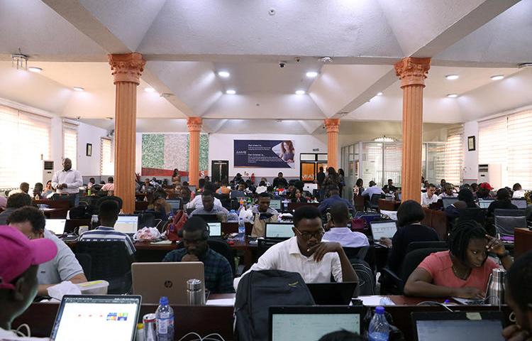 People use computers in Lagos, Nigeria, on January 20, 2020. Nigerian journalists recently spoke with CPJ about their concerns over a proposed social media bill. (Reuters/Temilade Adelaja)