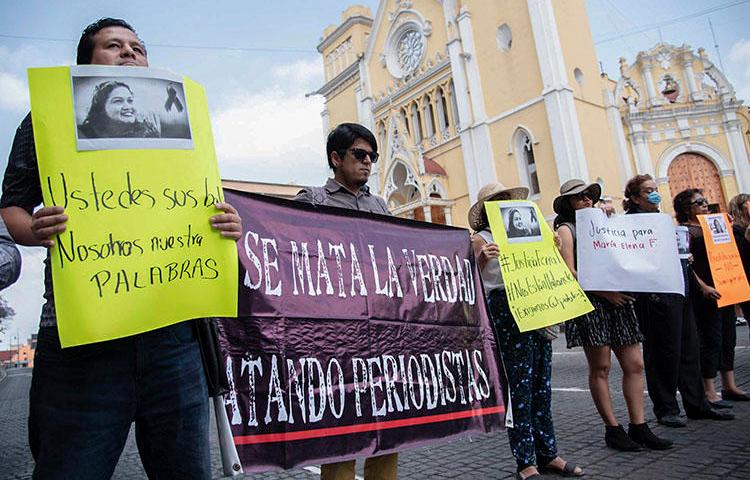 Journalists demonstrate against the killing of their colleague Maria Helena Ferral at Lerdo square in Xalapa, Veracruz state, Mexico on April 1, 2020. (AFP/Hector Quintanar)