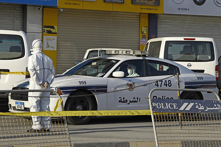 A police cruiser is seen on the outskirts Manama, Bahrain, on March 13, 2020. CPJ joined a letter calling on Bahrain to release all its imprisoned journalists. (AFP/Mazen Mahdi)