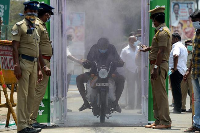 Police are seen in Chennai, Tamil Nadu state, India, on April 5, 2020. Tamil Nadu police recently arrested journalist Andrew Sam Raja Pandian. (AFP/Arun Sankar)