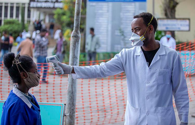 People have their temperatures checked at the Zewditu Memorial Hospital in Addis Ababa, Ethiopia, on March 18, 2020. Journalist Yayesew Shimelis was recently detained over a report about the pandemic. (AP/Mulugeta Ayene)