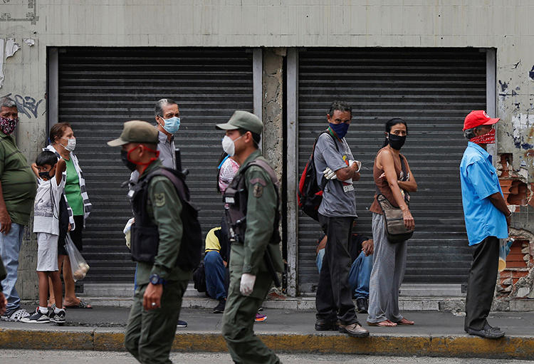 Members of the national guard are seen in Caracas, Venezuela, on April 3, 2020. National Guard officers recently arrested journalist Eduardo Galindo and his family. (Reuters/Manaure Quintero)