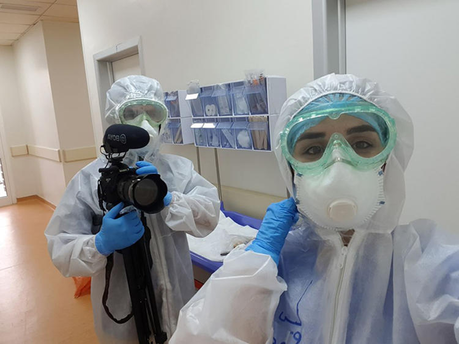 Freelance photographer and videographer Zmnako Ismael (left) is seen covering the COVID-19 pandemic. (Zmnako Ismael)