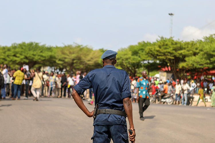 A police officer is seen in Cotonou, Benin, on March 9, 2018. A court recently shortened journalist Ignace Sossou’s jail term, but did not free him. (AFP/Yanick Folly)