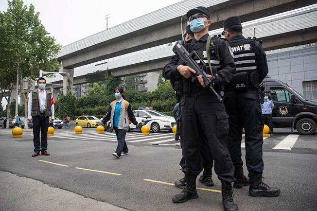 Police officers are seen in Wuhan, China, on May 6, 2020. Journalist Zhang Zhan recently went missing in Wuhan, and is now detained in Shanghai. (AFP)