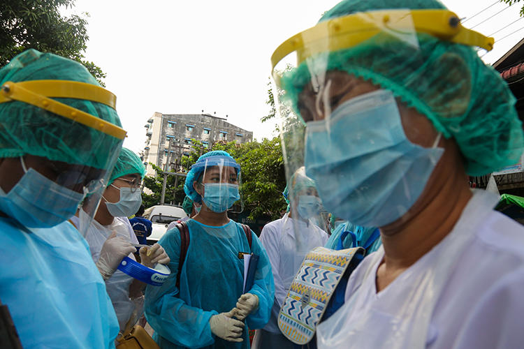 Medical staff are seen in Yangon, Myanmar, on May 17, 2020. Myanmar authorities recently sentenced news editor Zaw Ye Htet to prison over his outlet's COVID-19 coverage. (AFP/Sai Aung Main)