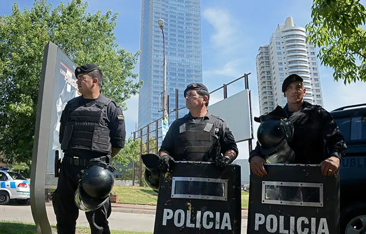 Police are seen in Montevideo, Uruguay, on January 8, 2015. Proposed legislation in Uruguay's parliament would criminalize insulting the police. (AFP/Mario Goldman)