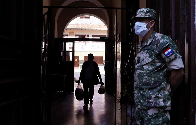 A soldier is seen in Asuncion, Paraguay, on April 22, 2020. Two Paraguayan journalists were recently targeted by hackers who stole information from their phones. (AP/Jorge Saenz)